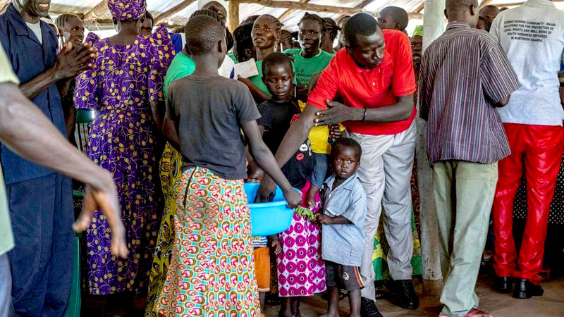 People giving their offering during Keliko church service